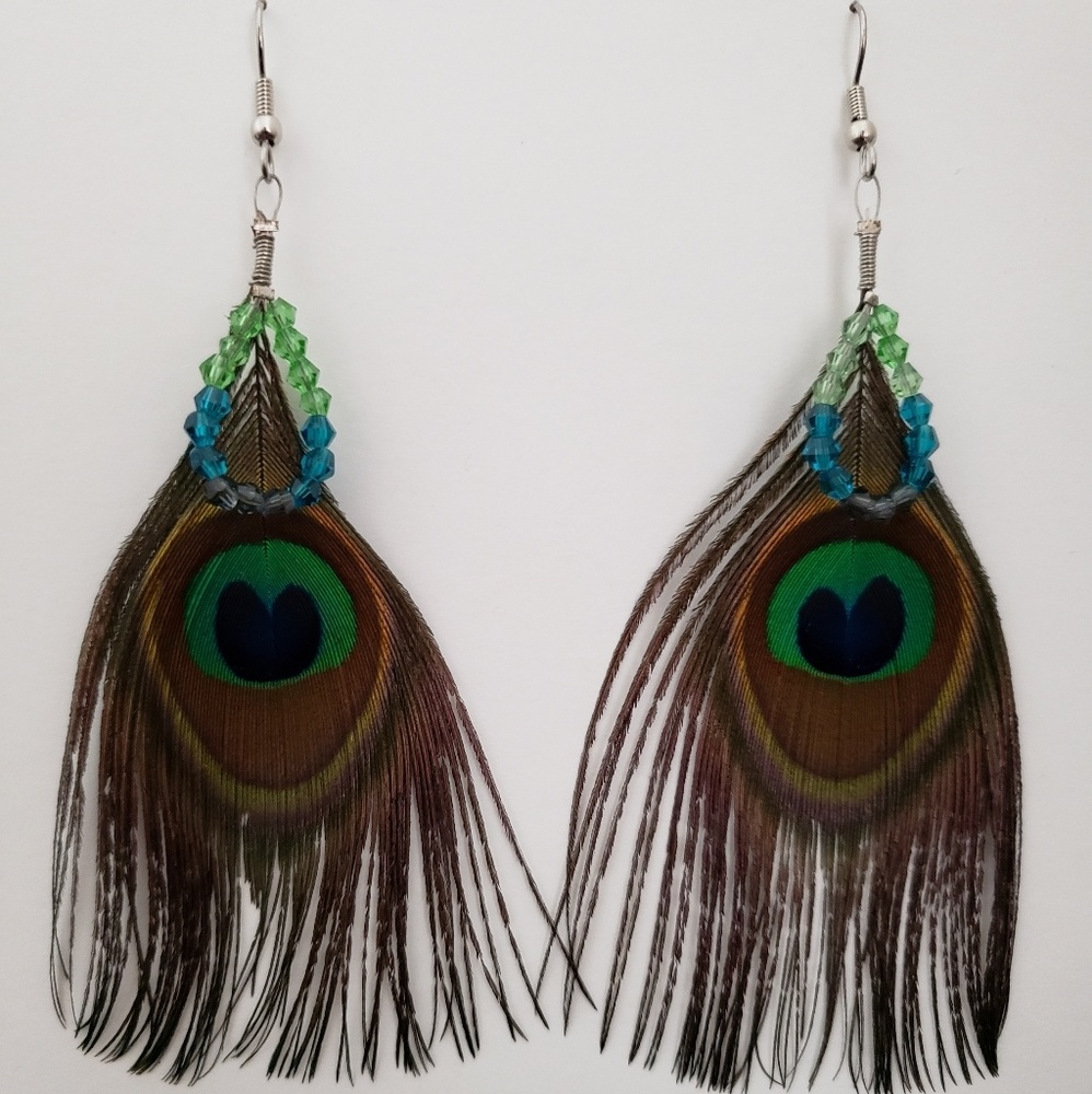 Peacock feather earrings with crystals.